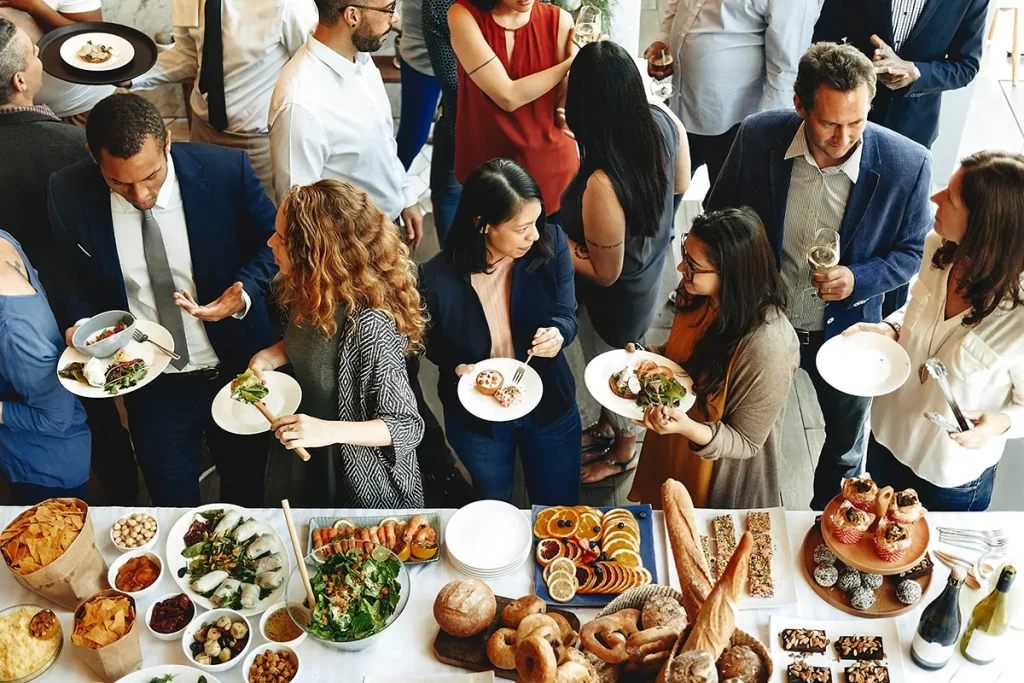 A busy holiday office party and the buffet table.